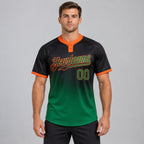 Custom Black Gradient Two Button Softball Jersey with Kelly Green and Orange Lettering worn by male model