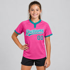 Custom Pink Two Button Softball Jersey with Teal and White Lettering youth size worn by child model