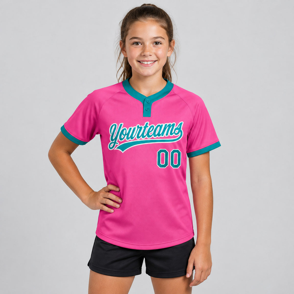 Custom Pink Two Button Softball Jersey with Teal and White Lettering youth size worn by child model