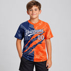 Custom White Graffiti Scratch Two Button Softball Jersey with Orange and Navy Lettering youth size worn by child model