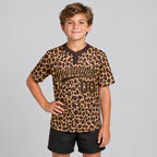 Custom Brown Leopard Two Button Softball Jersey with Brown and Old Gold Lettering youth size worn by child model