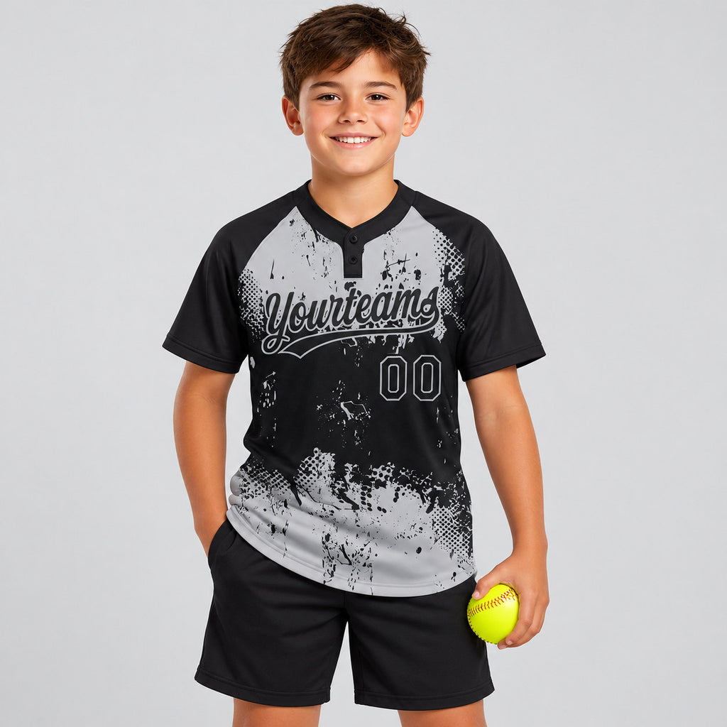 Custom Black Abstract Splatter Grunge Art Two Button Softball Jersey with Gray Lettering youth size worn by child model