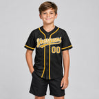 Custom Black Button Down Reversible Baseball Jersey with Old Gold and White Lettering youth size worn by child model