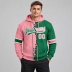 Custom Kelly Green Ripped Split Baseball Pullover Hoodie with Medium Pink and White Lettering worn by male model