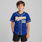 Custom Royal Button Down Reversible Baseball Jersey with White and Old Gold Lettering youth size worn by child model