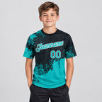 Custom Aqua Abstract Brush Stroke Performance T-Shirt with Black and White Lettering youth size worn by child model