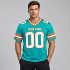 Custom Aqua Authentic Football Jersey with White and Orange Lettering Design 0215 worn by male model