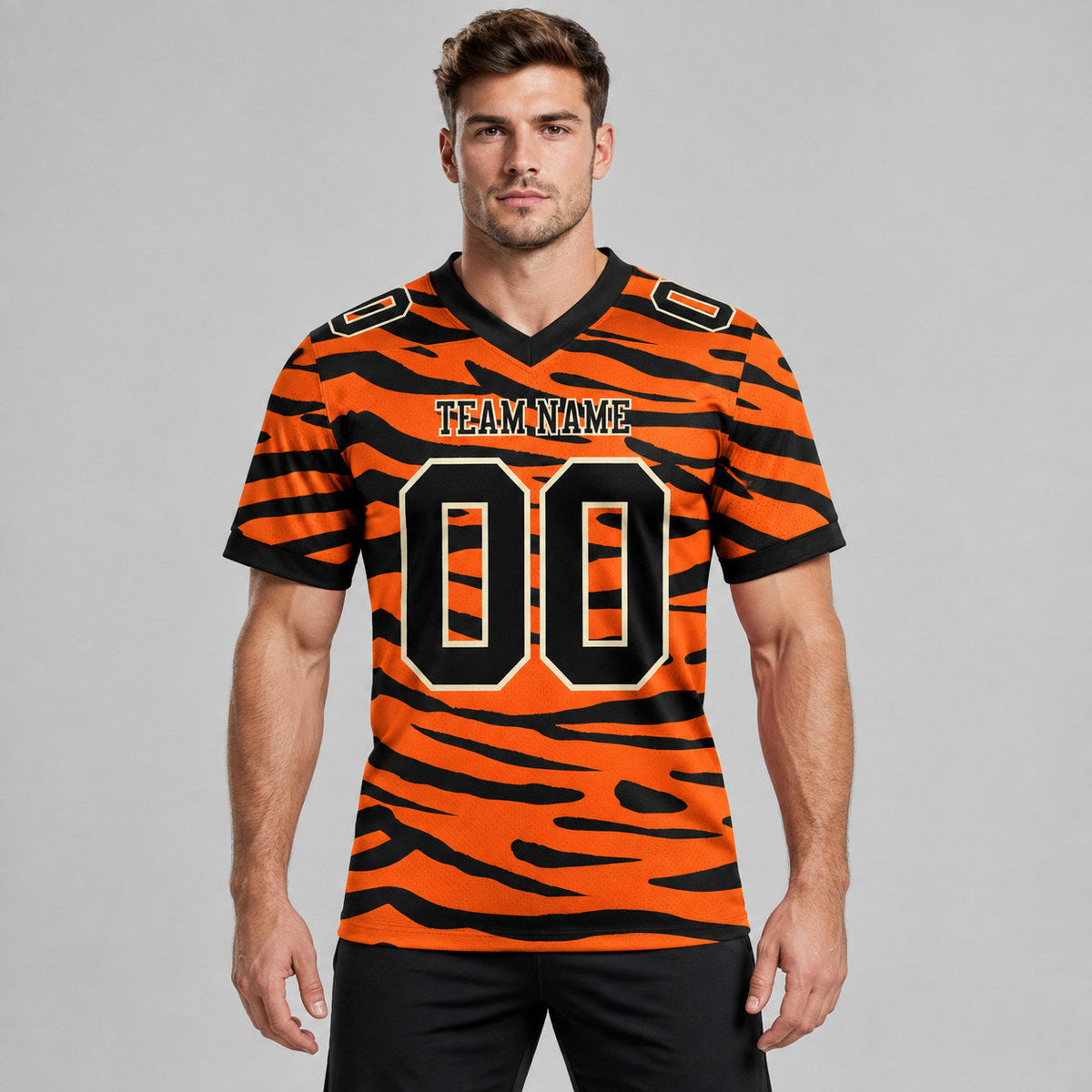 Custom Orange Tiger Print Authentic Football Jersey with Black and Cream Lettering worn by male model
