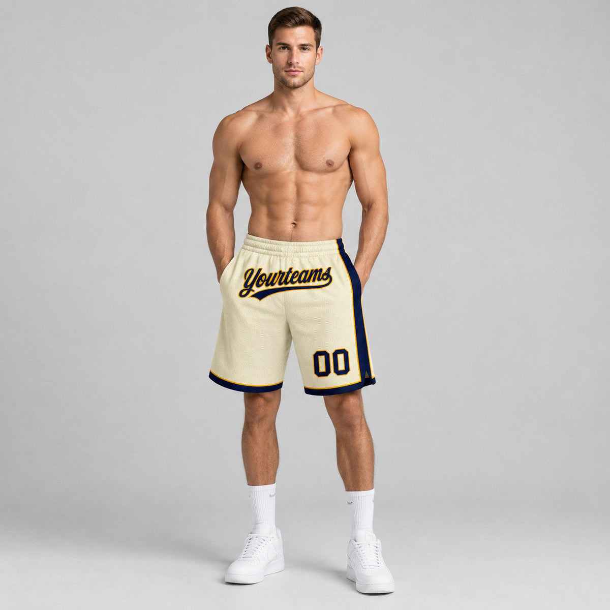 Custom Cream Authentic Basketball Shorts with Navy and Gold Lettering worn by male model