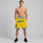 Custom Gold and Black Pinstripe Authentic Basketball Shorts with Kelly Green and White Lettering worn by male model