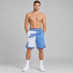 Custom White Authentic Throwback Basketball Shorts with Light Blue and Royal Lettering worn by male model