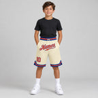 Custom Cream Authentic Throwback Basketball Shorts with Orange and Royal Lettering Design 0084 youth size worn by child model