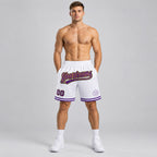 Custom White and Purple Authentic Throwback Basketball Shorts with Old Gold and Black Lettering worn by male model