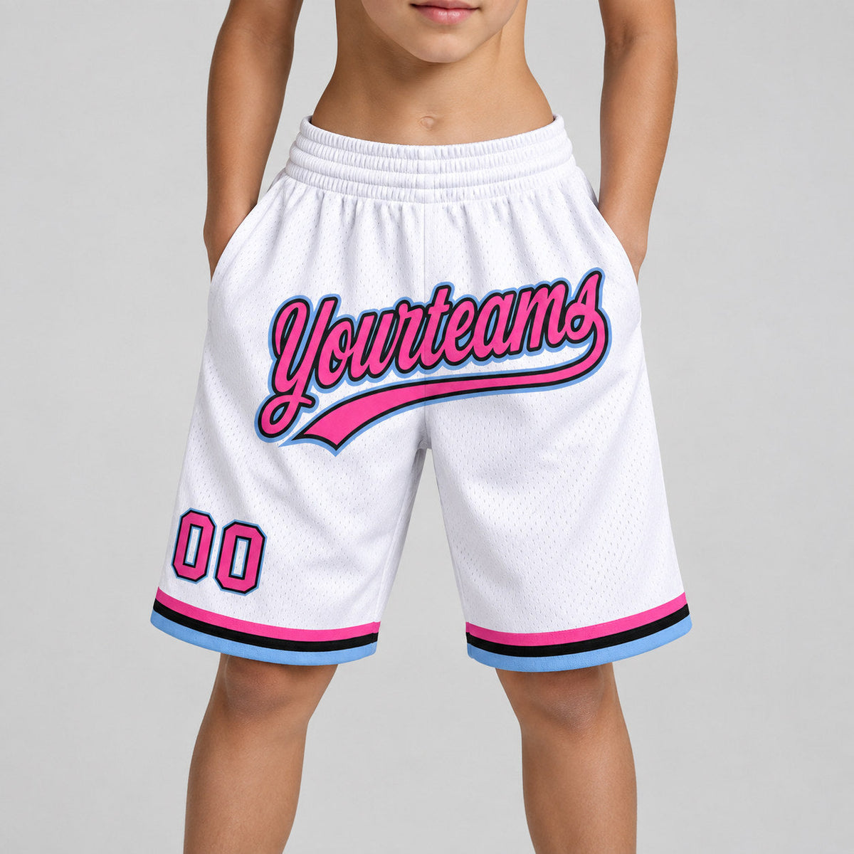 Custom White and Pink Authentic Throwback Basketball Shorts with Black and Light Blue Lettering youth size worn by child model