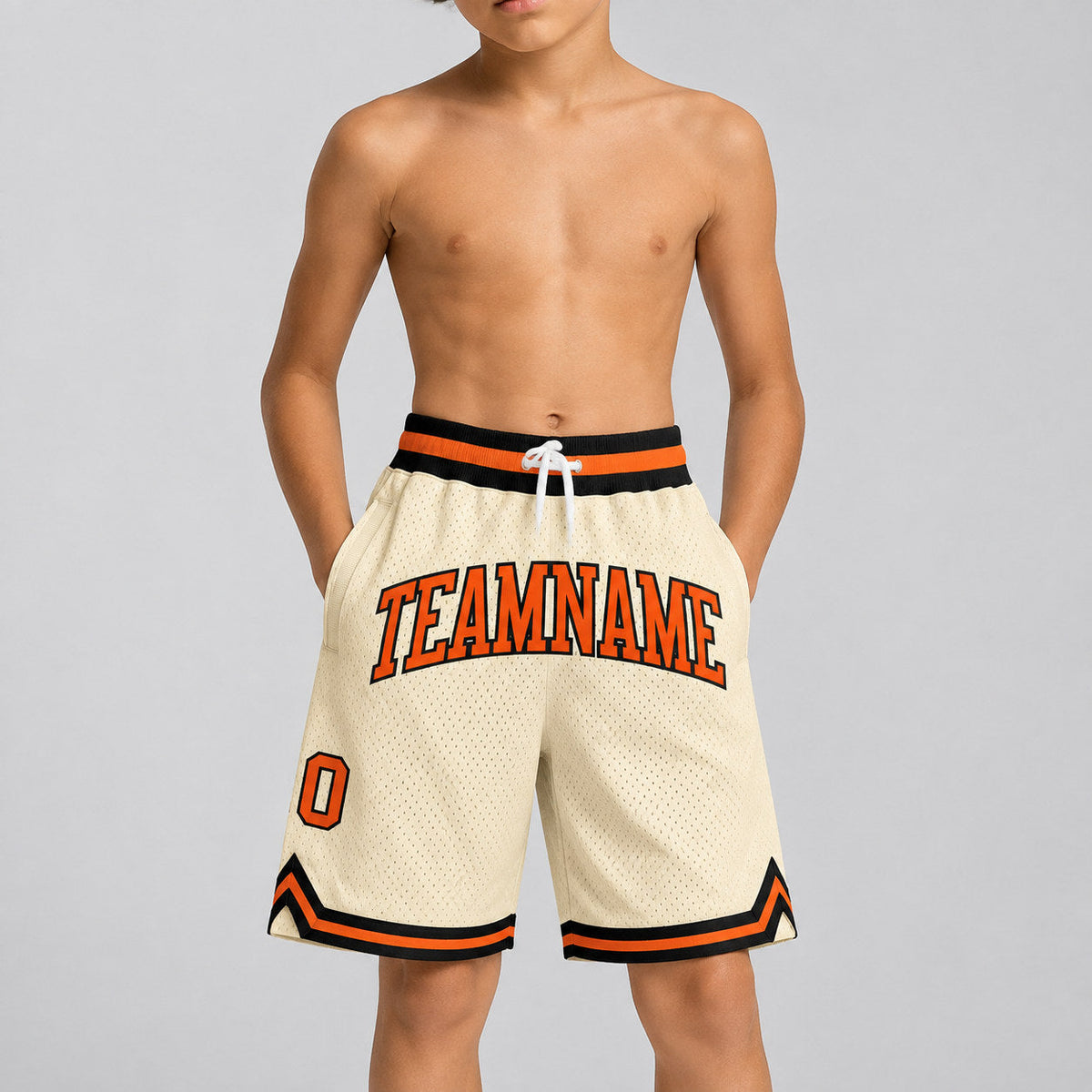 Custom Cream Authentic Throwback Basketball Shorts with Orange and Black Lettering Design 0365 youth size worn by child model