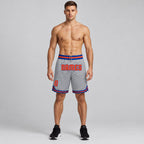 Custom Gray Authentic Throwback Basketball Shorts with Orange and Royal Lettering worn by male model