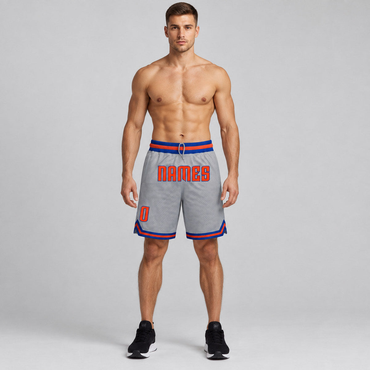 Custom Gray Authentic Throwback Basketball Shorts with Orange and Royal Lettering worn by male model