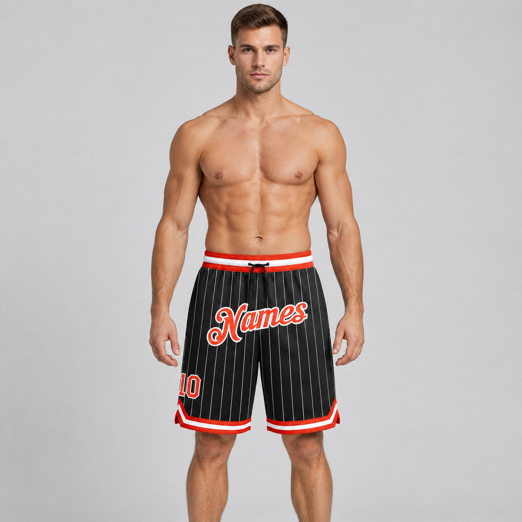 Custom Black and White Pinstripe Authentic Basketball Shorts with Orange and White Lettering worn by male model