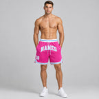 Custom Pink Authentic Throwback Basketball Shorts with White and Light Blue Lettering Design 0046 worn by male model