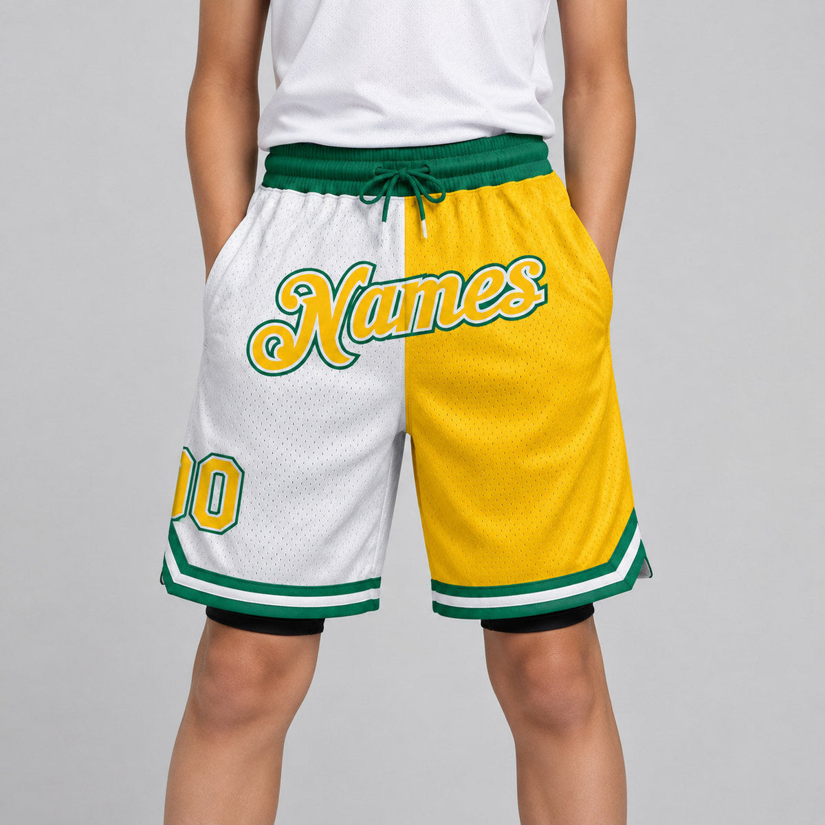 Custom White Authentic Throwback Basketball Shorts with Gold and Kelly Green Lettering youth size worn by child model