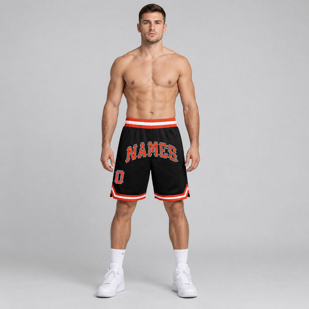 Custom Black Authentic Throwback Basketball Shorts with Orange and White Lettering Design 0309 worn by male model