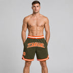 Custom Olive Salute To Service Authentic Throwback Basketball Shorts with Orange and White Lettering worn by male model