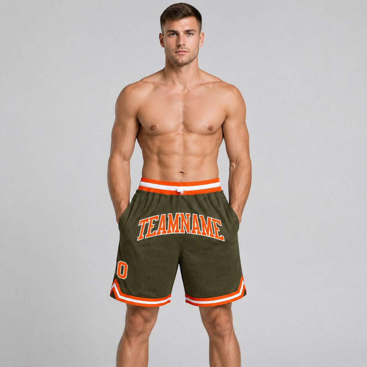 Custom Olive Salute To Service Authentic Throwback Basketball Shorts with Orange and White Lettering worn by male model