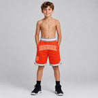 Custom Orange Authentic Throwback Basketball Shorts with Orange and Gray Lettering youth size worn by child model