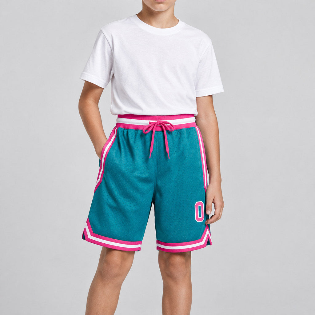 Custom Teal Authentic Throwback Basketball Shorts with Pink and White Lettering youth size worn by child model