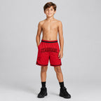 Custom Red Authentic Throwback Basketball Shorts with Red and Black Lettering youth size worn by child model