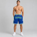 Custom Royal Authentic Throwback Basketball Shorts with Kelly Green and White Lettering worn by male model