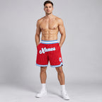 Custom Red and White Pinstripe Authentic Basketball Shorts with White and Light Blue Lettering worn by male model