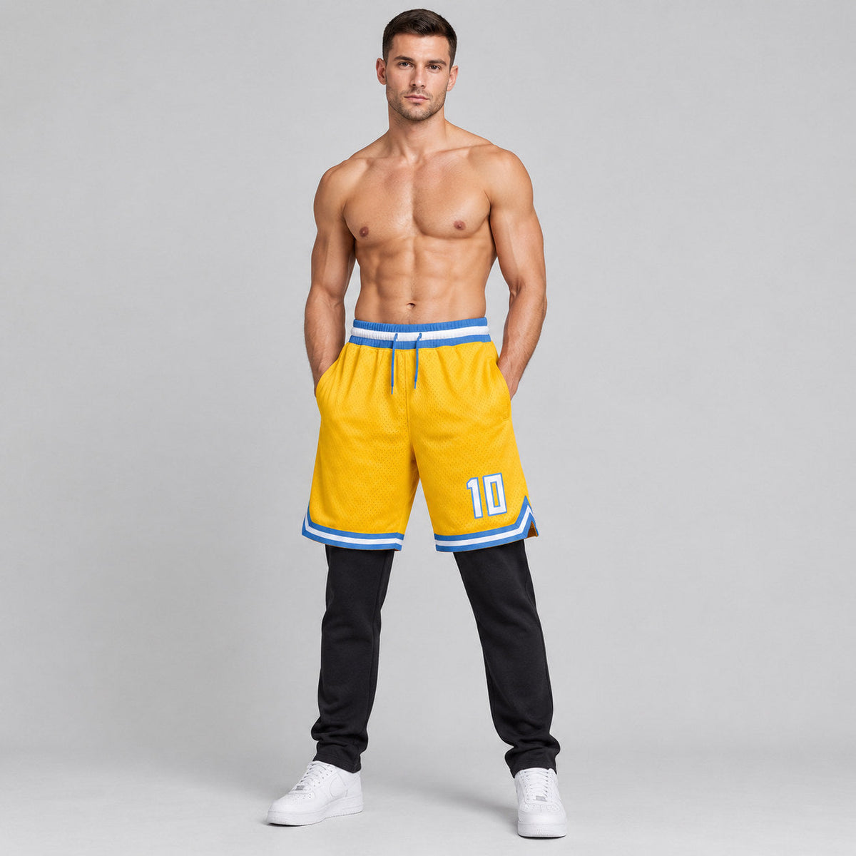 Custom Gold Authentic Throwback Basketball Shorts with White and Light Blue Lettering worn by male model