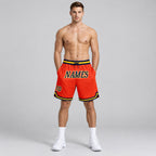 Custom Orange Authentic Throwback Basketball Shorts with Navy and Gold Lettering worn by male model