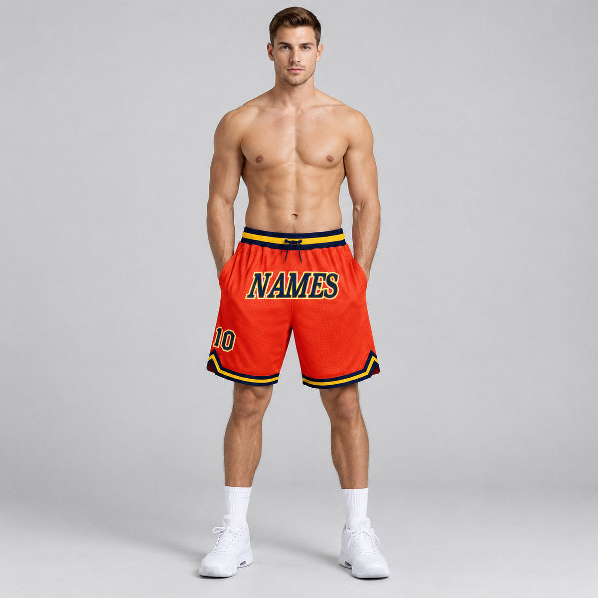 Custom Orange Authentic Throwback Basketball Shorts with Navy and Gold Lettering worn by male model