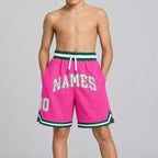 Custom Pink Authentic Throwback Basketball Shorts with White and Kelly Green Lettering youth size worn by child model