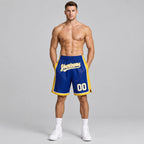 Custom Royal Authentic Basketball Shorts with White and Yellow Lettering worn by male model
