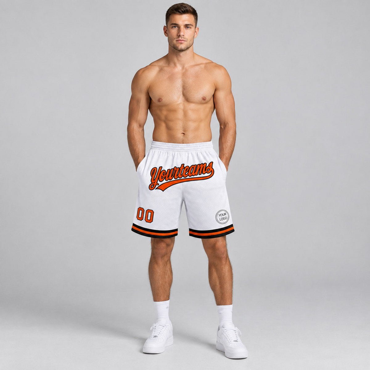 Custom White Authentic Throwback Basketball Shorts with Orange and Black Lettering worn by male model
