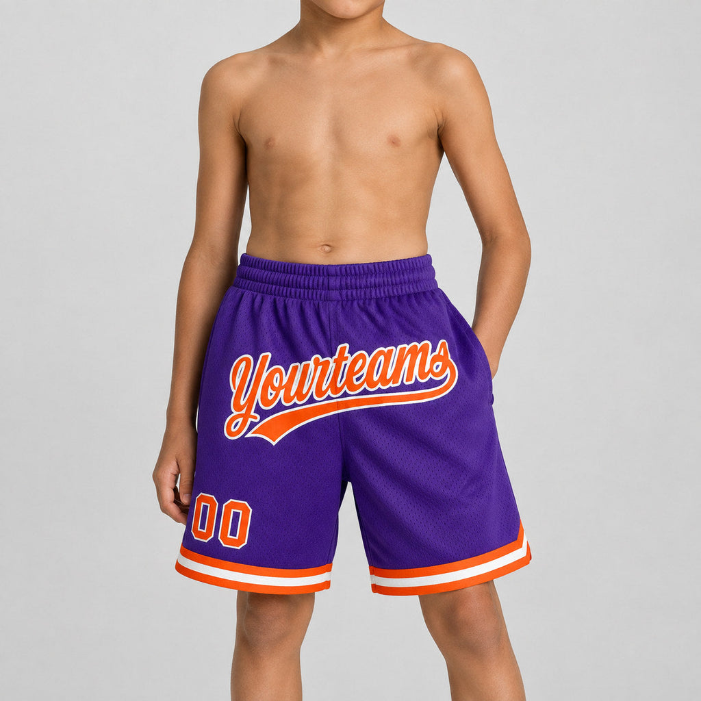 Custom Purple Authentic Throwback Basketball Shorts with Orange and White Lettering youth size worn by child model