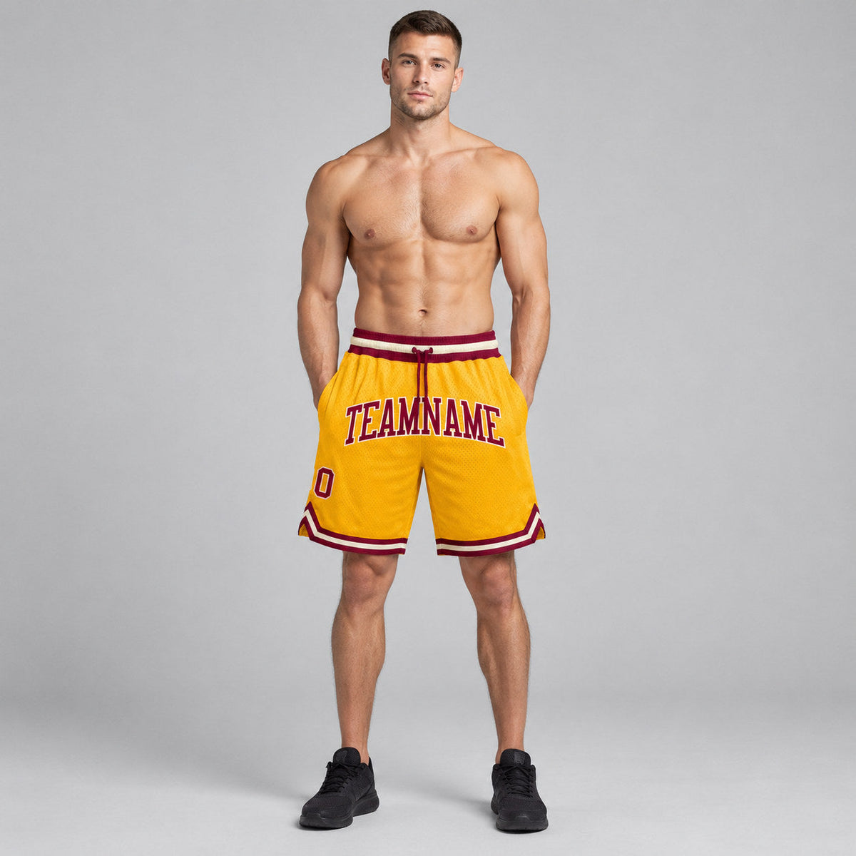 Custom Gold Authentic Throwback Basketball Shorts with Maroon and Cream Lettering worn by male model