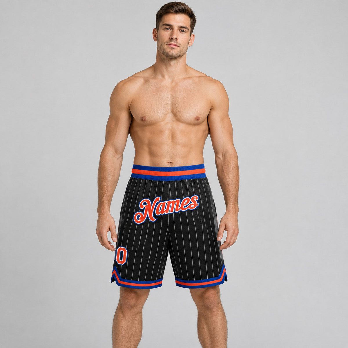 Custom Black and White Pinstripe Authentic Basketball Shorts with Orange and Royal Lettering worn by male model