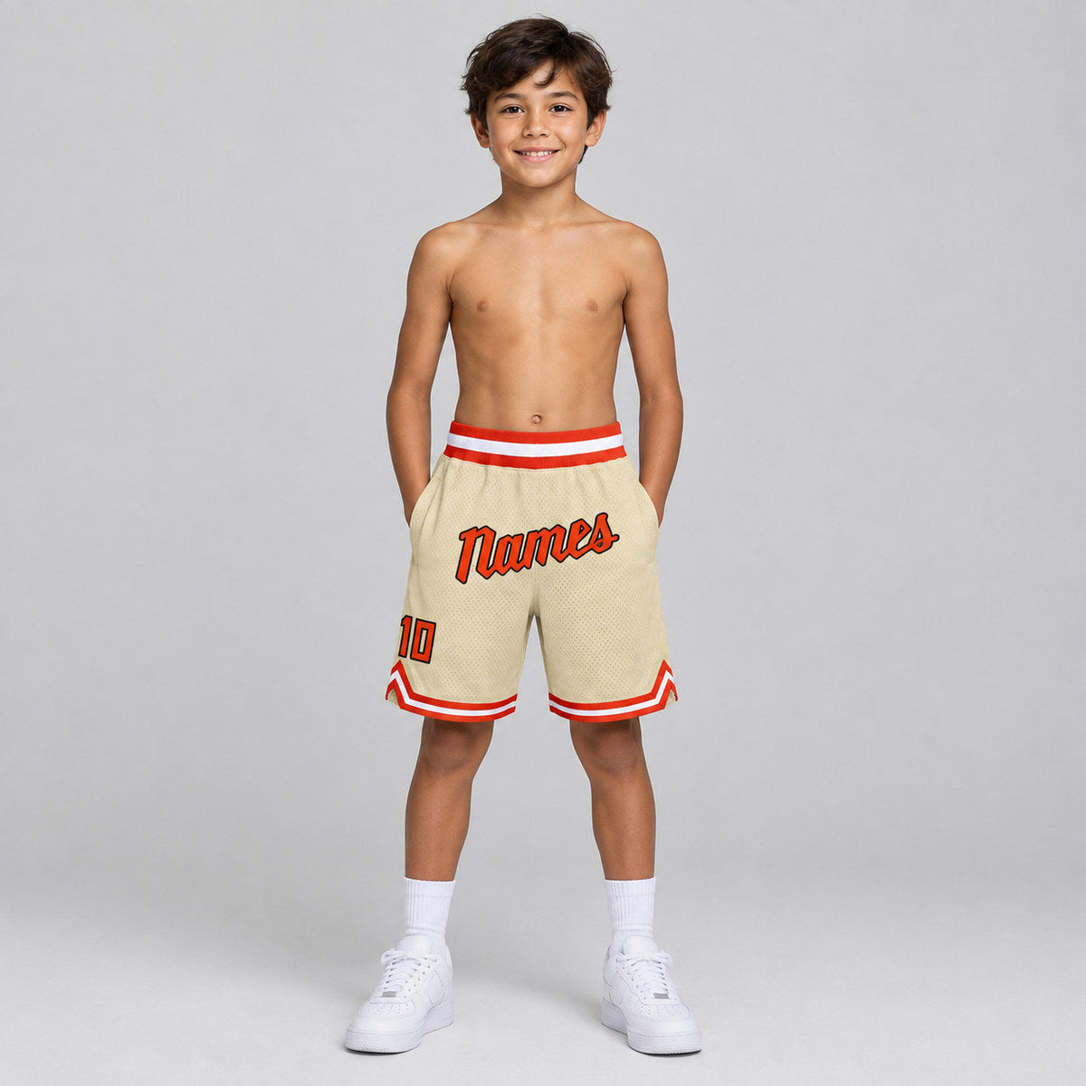 Custom Cream Authentic Throwback Basketball Shorts with Orange and White Lettering Design 0082 youth size worn by child model