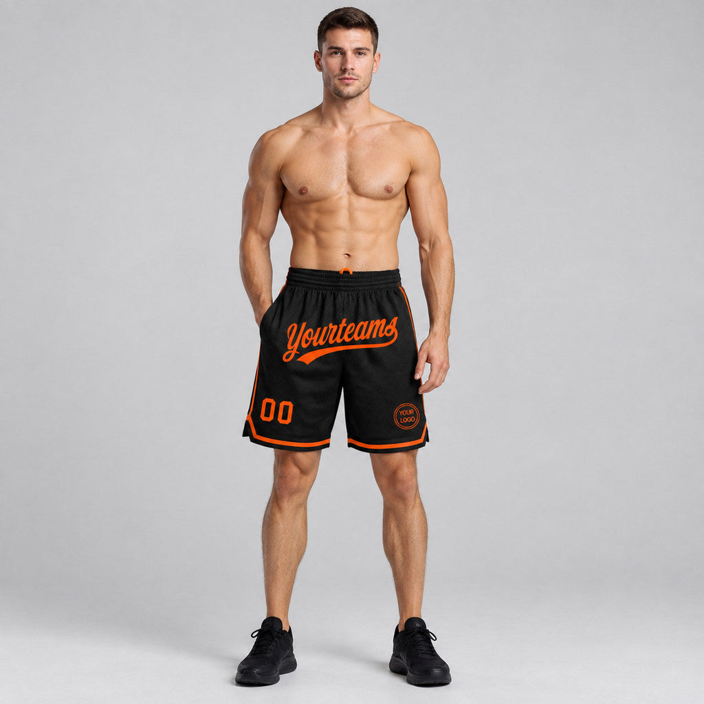 Custom Black Authentic Throwback Basketball Shorts with Orange Lettering Design 1405 worn by male model