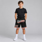 Custom Black Vintage USA Flag Authentic Throwback Basketball Shorts with Cream Lettering youth size worn by child model