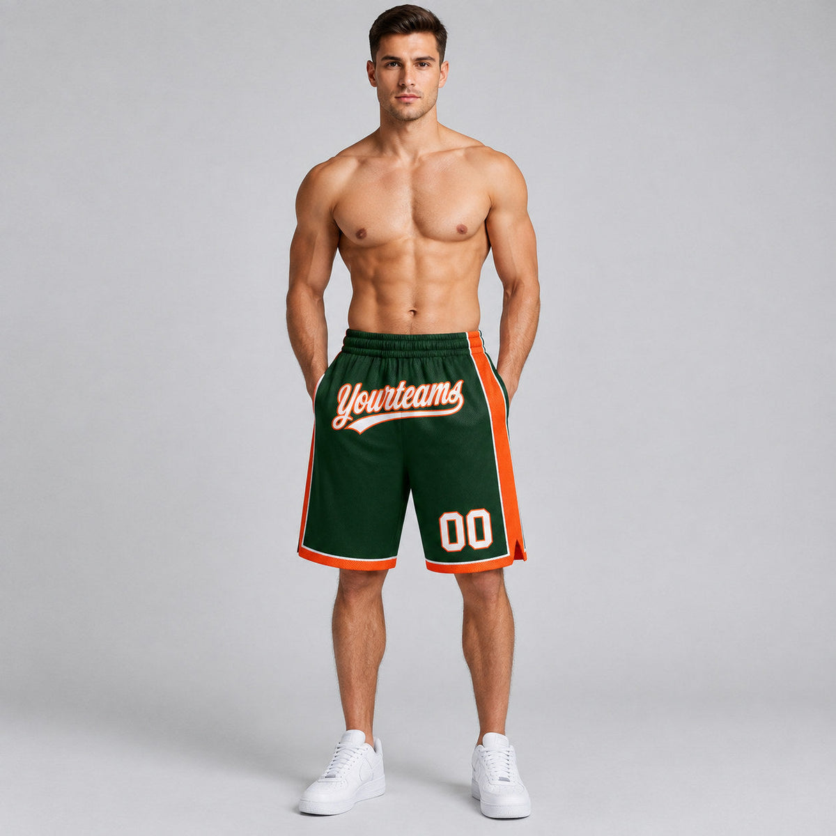 Custom Hunter Green Authentic Basketball Shorts with White and Orange Lettering worn by male model