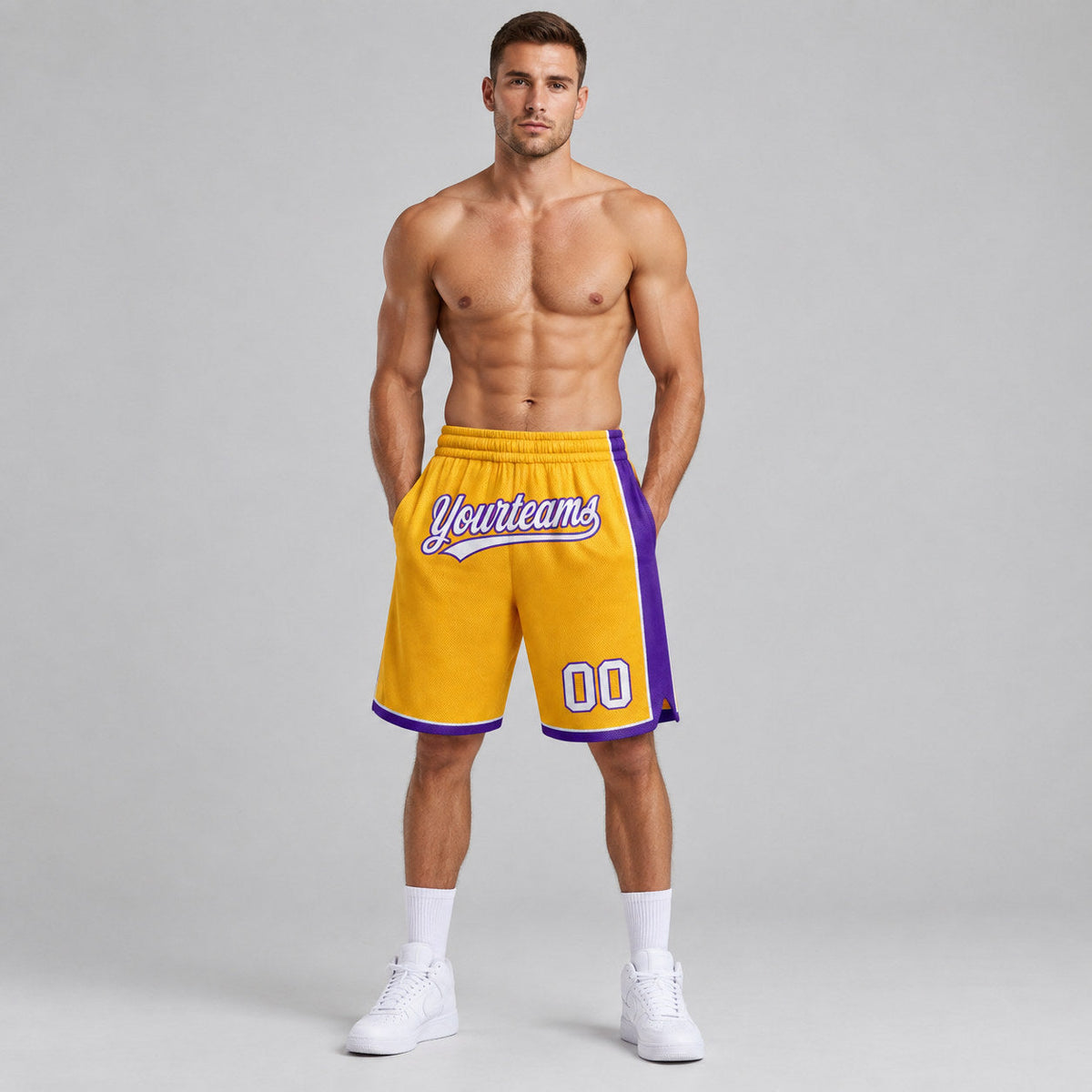 Custom Gold Authentic Basketball Shorts with White and Purple Lettering worn by male model