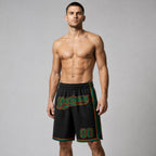 Custom Black Authentic Basketball Shorts with Kelly Green and Orange Lettering worn by male model