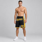 Custom Black Authentic Basketball Shorts with Gold and White Lettering worn by male model