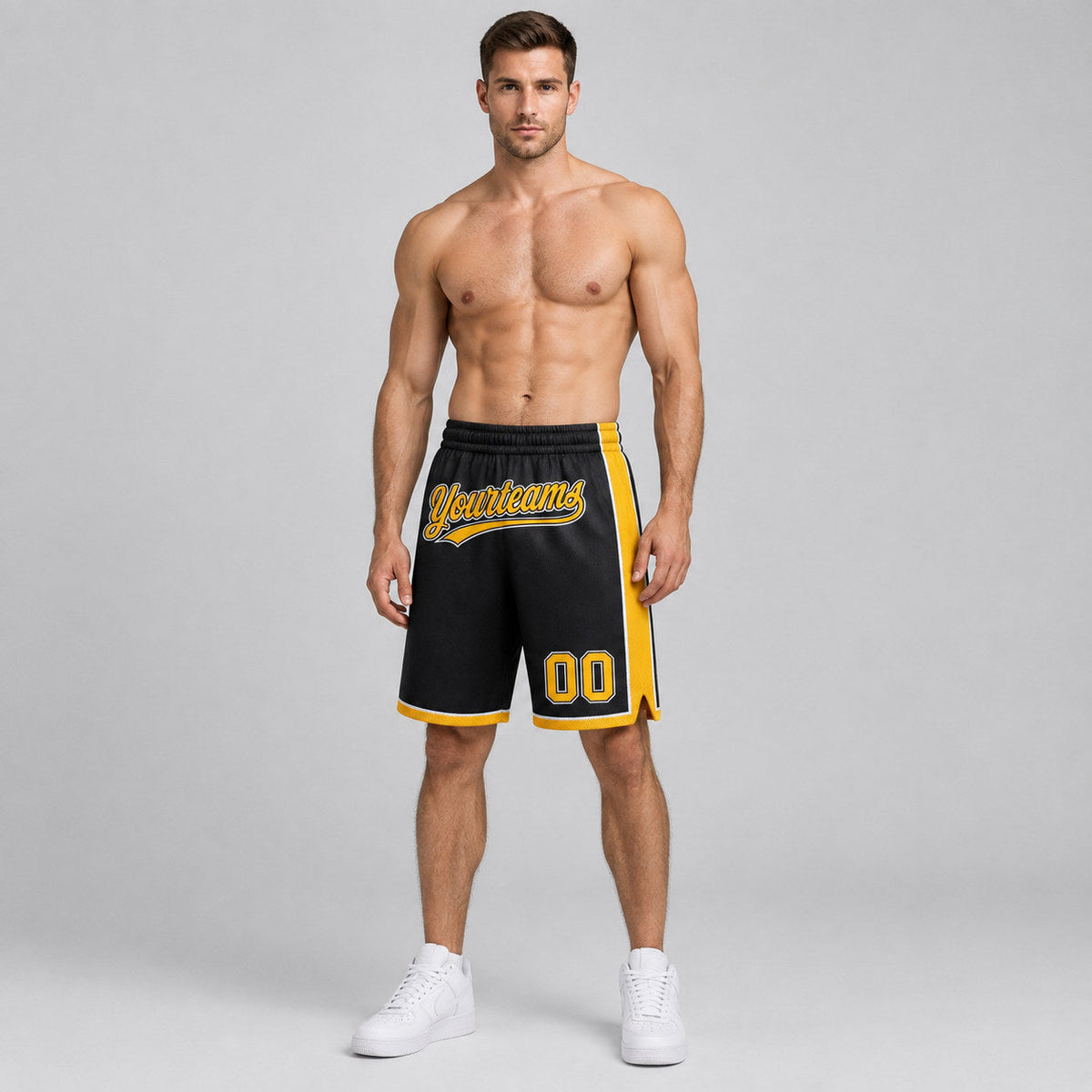 Custom Black Authentic Basketball Shorts with Gold and White Lettering worn by male model