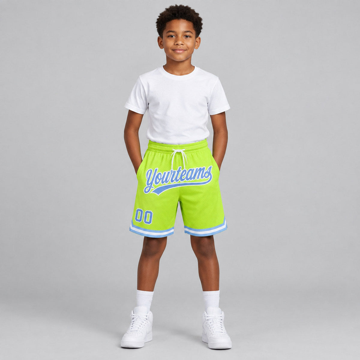 Custom Neon Green Authentic Throwback Basketball Shorts with Light Blue and White Lettering youth size worn by child model